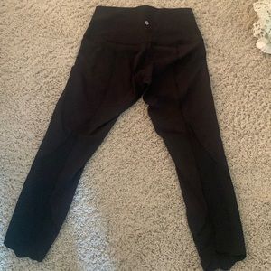 Like new black size 8 lululemon leggings with scalloped detail